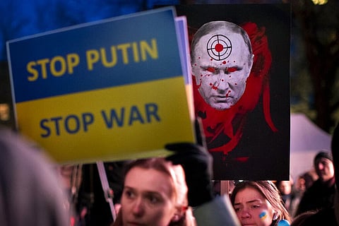 People take part in a protest against the Russian invasion of Ukraine in front of the Russian embassy in Vilnius, Lithuania. (Photo | AP)