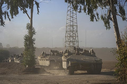A convoy of Israeli armoured personnel carriers (APC) head towards the Gaza Strip border in southern Israel on Sunday, Oct. 15, 2023. (Photo | AP)