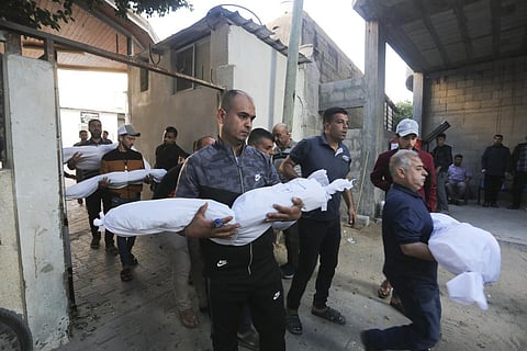 Palestinians carry the members of a family who were killed in an Israeli strike in Rafah, Gaza Strip, Tuesday, Oct. 31, 2023. (Photo | AP)