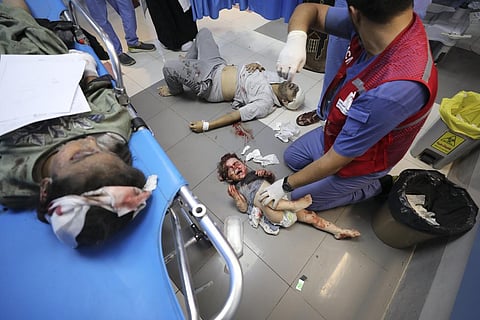 Palestinians wounded in Israeli strikes are brought to Shifa Hospital in Gaza City on Wednesday, Oct. 11, 2023. (AP)