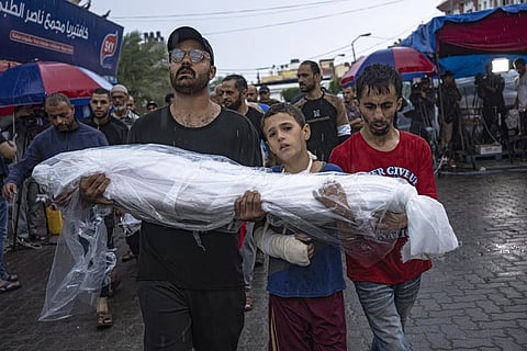 Palestinians mourn their relatives killed in the Israeli bombardment of the Gaza Strip, outside the hospital in Khan Younis, Tuesday, Nov. 14, 2023. (AP)