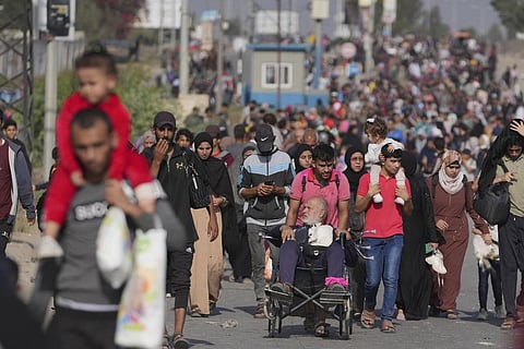 Palestinians flee to the southern Gaza Strip on Salah al-Din Street in Bureij, Gaza Strip, on November 8, 2023. (AP)