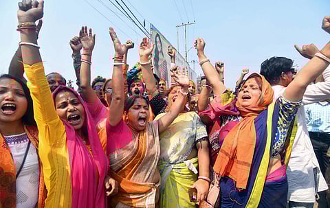 BJP supporters celebrate the party's lead during the counting of votes of the Tripura Assembly elections. (Photo | PTI)