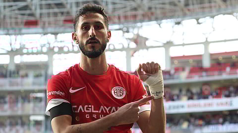 Antalyaspor's Sagiv Jehezkel points a message in his bandage that reads: "100 days. 7.10" as he celebrates after scoring his side's first goal during a Turkish Super Lig soccer match between Antalyaspor and Trabzonspor in Antalya, southern Turkey, Sunday, Jan. 14, 2024.