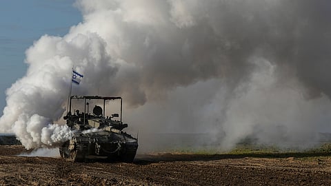 An Israeli army tank moves near the Gaza Strip border, in southern Israel.