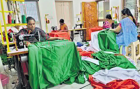 Women stitch national flags at the manufacturing unit in Khammam