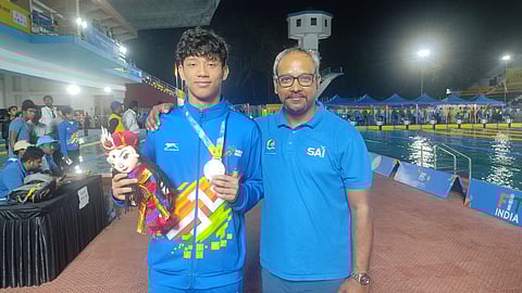 Tirthank Pegu with coach Partha Pratim Majumder.
