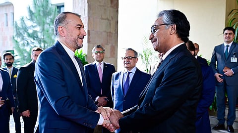 Pakistan's caretaker Foreign Minister Jalil Abbas Jilani, right, greets Iran's Foreign Minister Hossein Amirabdollahian upon his arrival for a meeting at Ministry of Foreign Affairs in Islamabad.