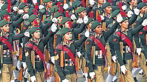 The audience cheered after all women contingent marched for the first time in its history; NCC cadets march past during the 75th Republic Day parade on Friday.