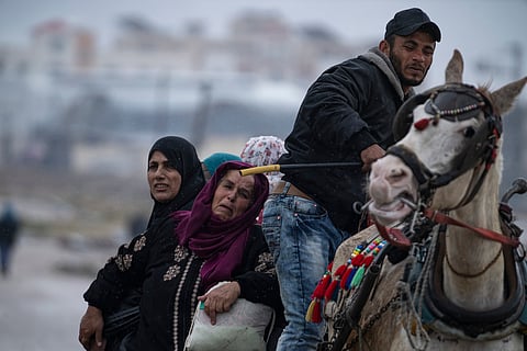 Palestinians arrive in the southern Gaza town of Rafah after fleeing an Israeli ground and air offensive in the nearby city of Khan Younis.