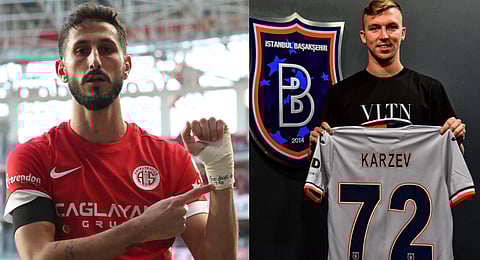 Antalyaspor's Sagiv Jehezkel (L) points a message in his bandage that reads: "100 days. 7.10"; Basaksehir's Israeli player Eden Karzev (R)