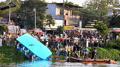 People gather during a rescue and search operation after a boat overturned in a lake, in Vadodara, Thursday, Jan. 18, 2024
