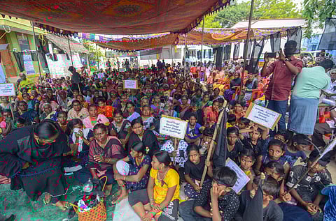 Villagers of Thenkalam raised concerns against the land acquisition process for a private solar power plant by hoisting black flags and staging protests.