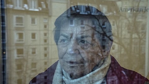 96-year-old Ruth Winkelmann, who is one of the survivors of the Holocaust, looks out of a window in Berlin, Germany, Wednesday, Jan 17, 2024.