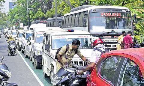 Police vehicles parked at Marine Drive on Monday as part of security measures ahead of the roadshow of Prime Minister Narendra Modi in the city.