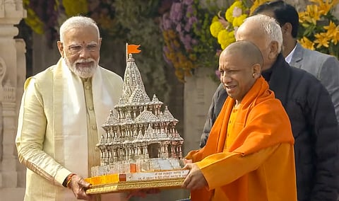 Prime Minister Narendra Modi being presented a replica of Ayodhya's Ram Mandir by Uttar Pradesh Chief Minister Yogi Adityanath after the 'Pran Pratishtha' ceremony at the Ram Mandir, in Ayodhya, on Jan. 22, 2024.