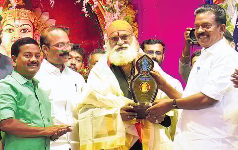 Devaswom Minister K Radhakrishnan presents this year’s ‘Harivarasanam’ award to Tamil singer P K Veeramani Dasan at a function held at Sannidhanam auditorium in Sabarimala on Monday. VETTIPURAM