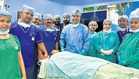 The baby with a team of surgeons led by Dr Radhamadhab Sahu.