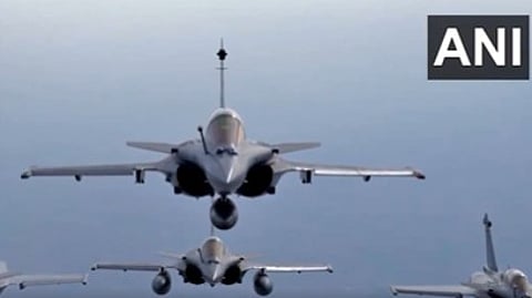 Six Rafale aircraft fly over Kartavya Path in 'Marut' formation during the 75th Republic Day celebrations.