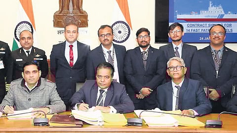 Representatives from Ministry of Defence and Mazagon Dock Shipbuilders sign the contract for acquisition of 14 fast patrol vessels on Wednesday.