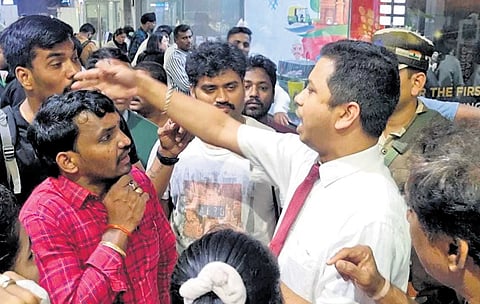 Frustrated air passengers questioning the airport authorities about the abrupt cancellation of flights, at Visakhapatnam airport on Sunday