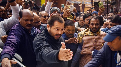 Former Bihar deputy chief minister Tejashwi Yadav arrives at the Enforcement Directorate's (ED) office for questioning in the alleged land-for-jobs scam, in Patna, Tuesday, Jan. 30, 2024.