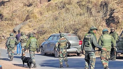 Security personnel carry out a search operation following an attack by suspected militants on an army convoy near Poonch on Jan 13, 2024.