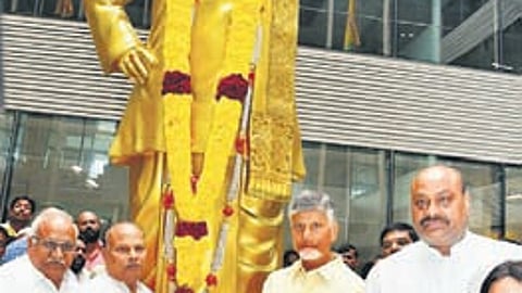 TDP chief N Chandrababu Naidu and other leaders pay floral tributes to the statue of NTR on Thursday.
