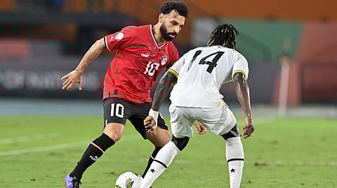 Egypt's Mohamed Salah fights for the ball with Ghana's defender Gideon Mensah during the Africa Cup of Nations (CAN) 2024 group B football match on January 18, 2024.