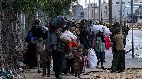 Palestinians flee from the city of Khan Younis in southern Gaza after an Israeli ground and air offensive on Monday, Jan. 29, 2024.