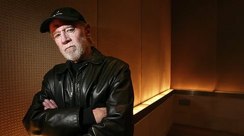 Actor and comedian George Carlin poses in a New York hotel March 19, 2004.