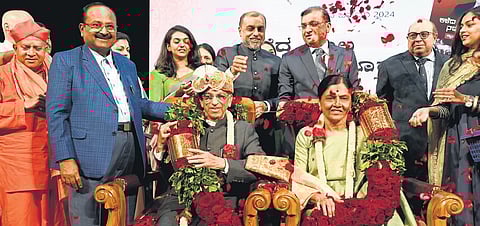 Justice Shivaraj V Patil and his wife being felicitated in Bengaluru on Sunday.