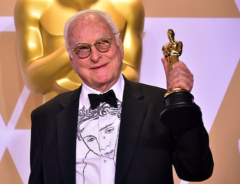 Writer James Ivory poses in the press room with the Oscar for Best Adapted Screenplay for "Call Me by Your Name," during the 90th Annual Academy Awards on March 4, 2018, in Hollywood, California.