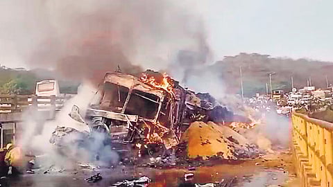 The truck driver lost control and rear-ended three cars and two other trucks. Two cars were trapped under the truck and went up in flames