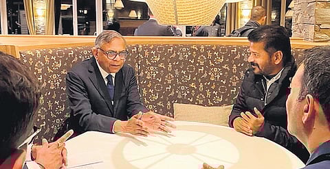 Chief Minister A Revanth Reddy interacts with Tata Sons chairman Natarajan Chandrasekaran during the World Economic Forum in Davos, Switzerland Thursday