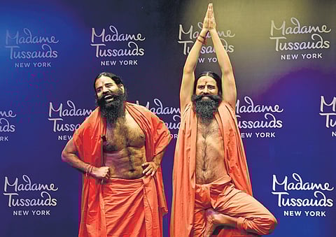 Yoga guru Ramdev during the unveiling of his wax figure by Madame Tussauds New York, in New Delhi, Tuesday, Jan. 30, 2024.