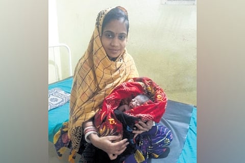 A mother with her newborn.