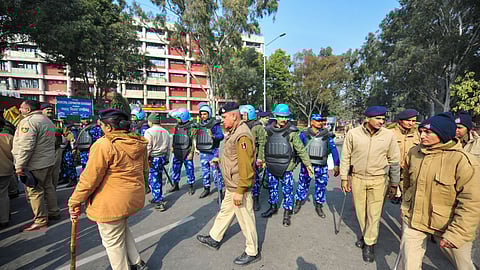 Security personnel stand guard after AAP and Congress councillors staged a protest following the Chandigarh mayoral polls result.