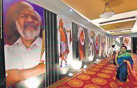 Visitors go through the Praja Yuddha Nauka Gaddar photo exhibition inaugurated by the chief minister at Ravindra Bharathi in Hyderabad on Wednesday