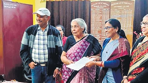 Dr Panda handing over the documents of her property to college authorities.