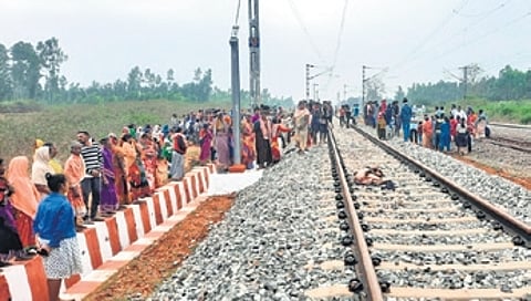 Villagers gather at the accident site on Thursday morning.