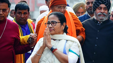 West Bengal CM Mamata Banerjee greets the gathering during Sanhati (integration) rally, in Kolkata on Monday.
