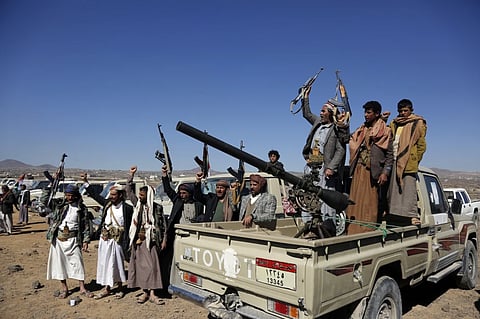 Houthi fighters and tribesmen stage a rally against the US and the UK strikes on "Houthi-run military sites near Sanaa, Yemen, on Sunday, January 14, 2024.