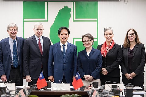 This handout from the Democratic Progressive Party (DPP) taken and released on January 15, 2024 shows Taiwan's President-elected Lai Ching-te (3rd L) and Taiwan's Vice President-elect Hsiao Bi-khim (3rd R) pose with members of an unofficial US delegation.