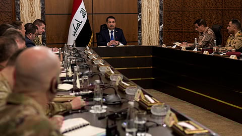 Iraqi Prime Minister Mohammed Shia al Sudani, center, chairs the first round of the negotiations between Iraq and the United States to end the International Coalition mission in Baghdad, Iraq, Saturday, Jan. 27, 2024.