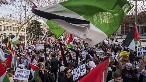 People march during a protest in support of Palestinians and calling for an immediate ceasefire in Gaza in downtown, Madrid, Spain, Saturday, Jan 27, 2024.