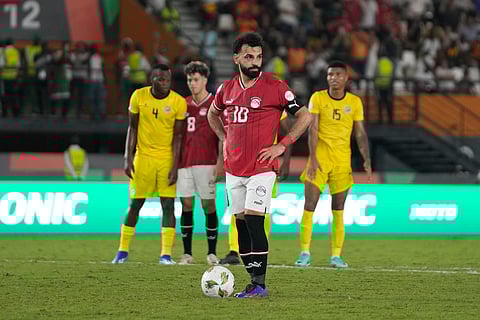 Egypt's Mohamed Salah waits to take a penalty, which he scores for his side's second goal of the game during the African Cup of Nations Group B soccer match between Egypt and Mozambique on Jan. 14, 2024.