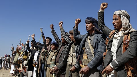 Houthi fighters and tribesmen stage a rally against the U.S. and the U.K. strikes on Houthi-run military sites near Sanaa, Yemen, on Sunday, Jan. 14, 2024.