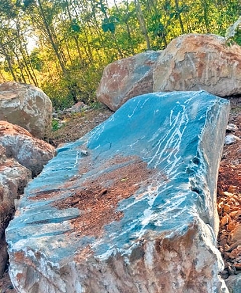 Rocks that were excavated from land belonging to farmer Ramdas (inset) at Gujjegowdanapura near Mysuru.