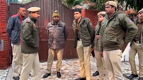 Police personnel stand guard outside Jharkhand Chief Minister Hemant Soren's residence, in New Delhi.
